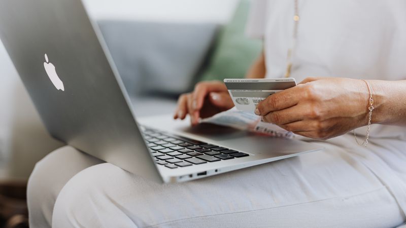 Paying online by card and bank transfer on a laptop