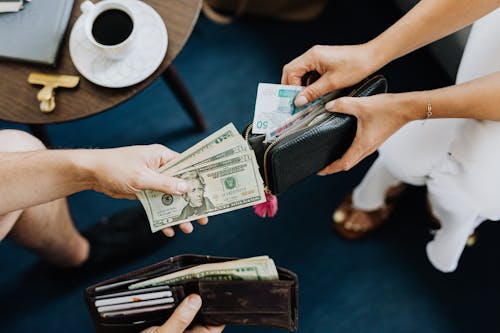 Free People Holding Money Stock Photo