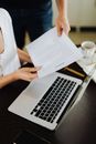 Two People Holding Contract Document