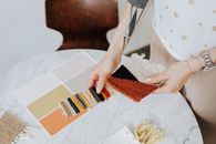 Woman Picking Materials and Paint from Samples 