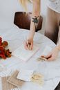 Person Writing on White Paper