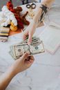 Hands Exchanging Dollars