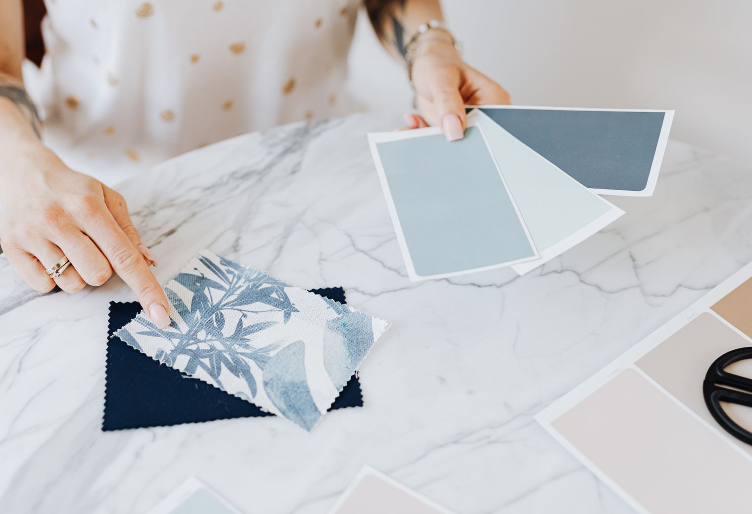 Wallpapering in South Street — careful masking before painting begins