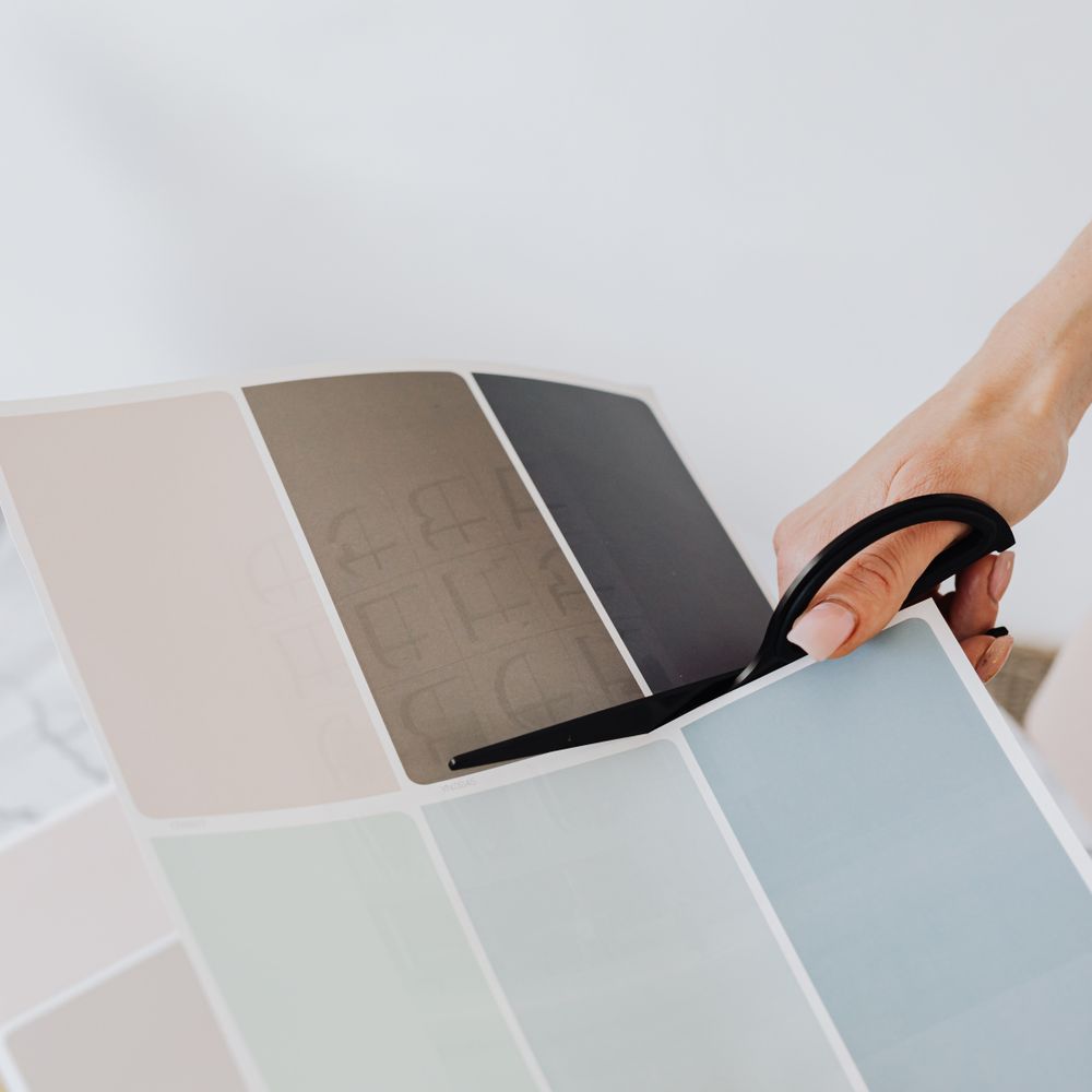 Wallpapering in Grove Park — woodwork brushed to a crisp, smooth line