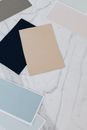 Brown and Blue Paper on White Textile