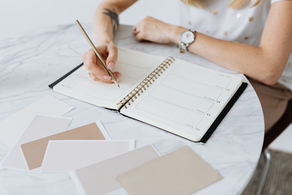 person writing shared schedule