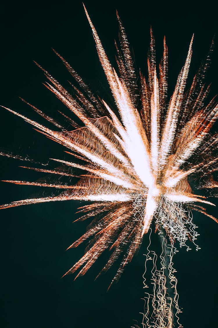 Glowing Bright Fireworks In Dark Sky