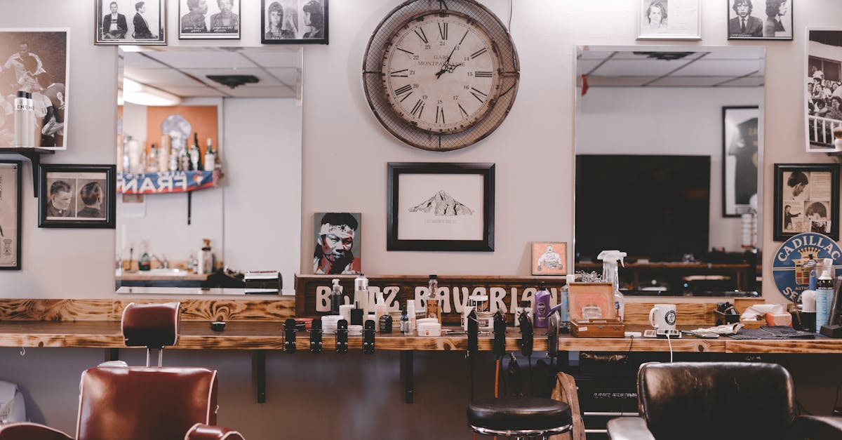 Stylish cozy interior design of modern hairdressing studio or barbershop with leather chairs stylish souvenirs and framed photos on walls