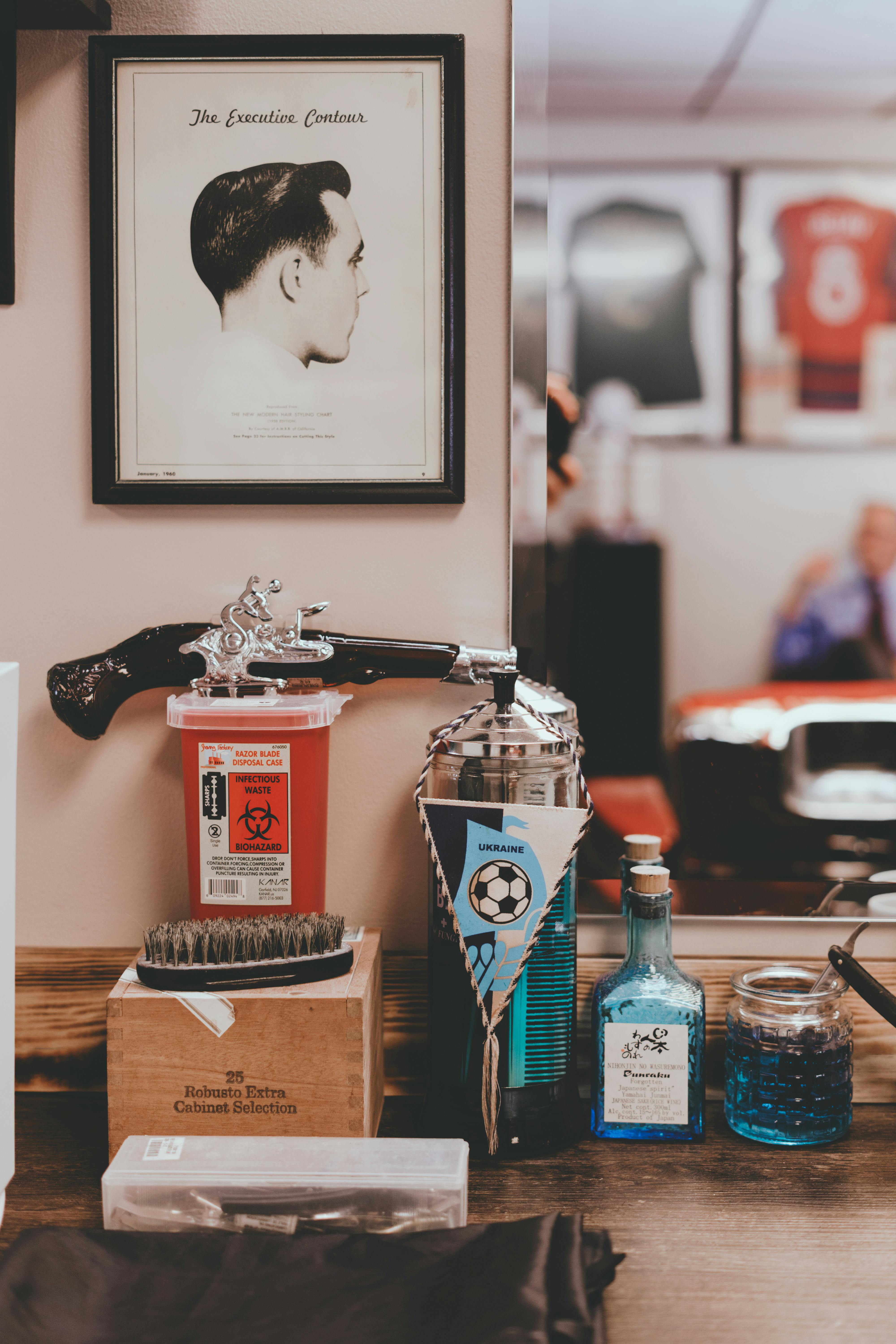 Table with various products in vintage barbershop · Free Stock Photo