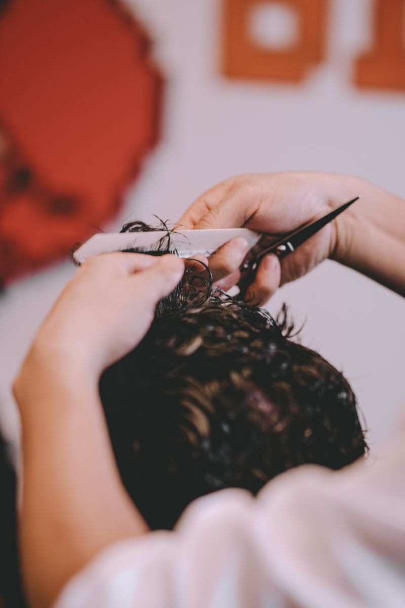 Barber cutting from above