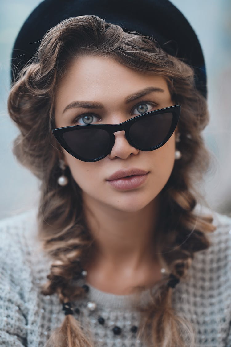 Stylish Woman In Sunglasses Looking At Camera