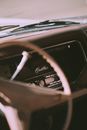 Old fashioned car interior with steering wheel