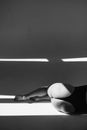 Grayscale Photo of Woman in Black Tank Top Lying on Floor