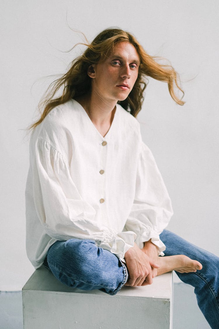 Long Hair Man In Shirt And Jeans