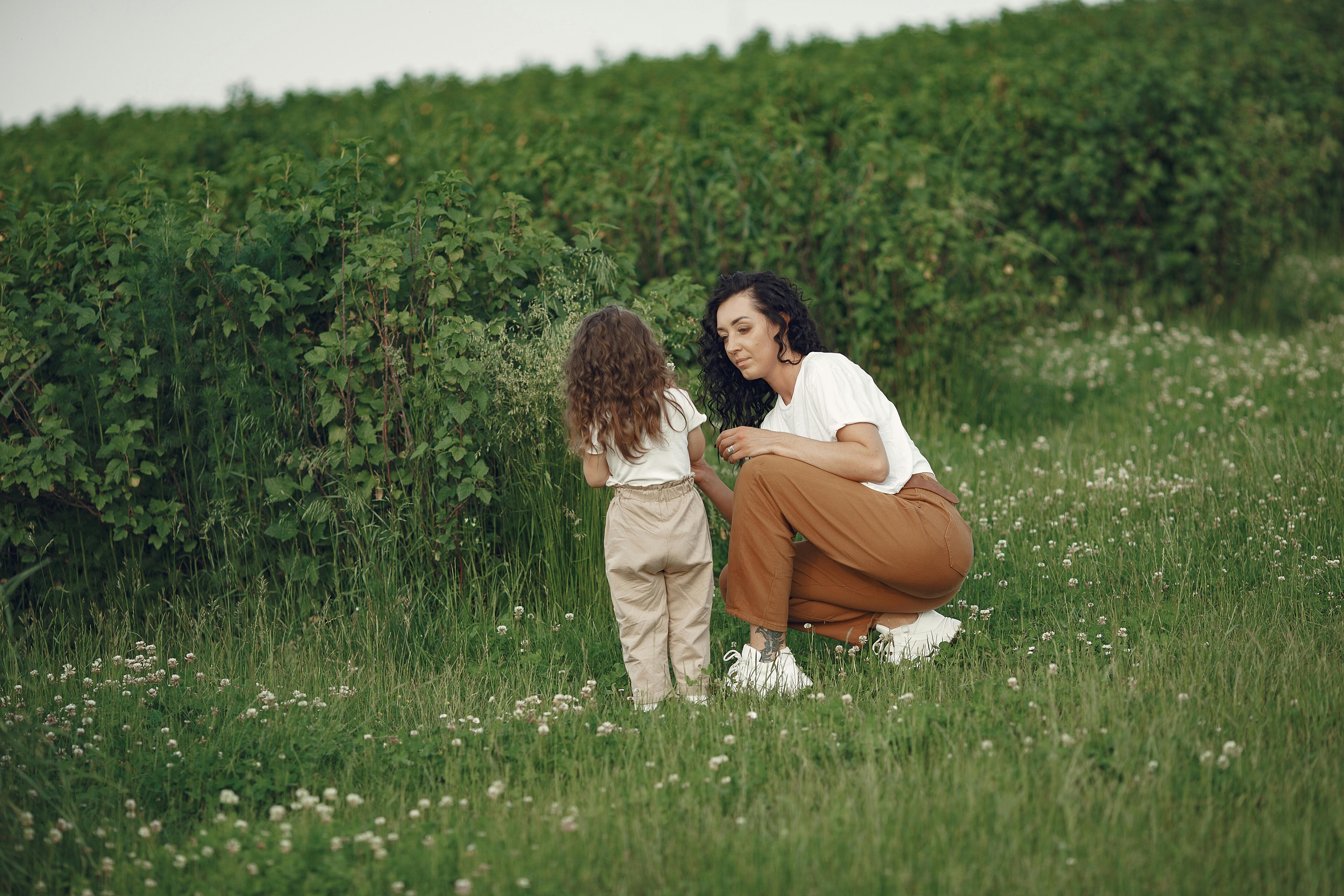 Mother And Daughter Playing Together In Grass · Free Stock Photo