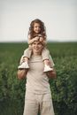Father Carrying His Daughter on Shoulders