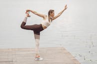 Woman Stretching on a Pier