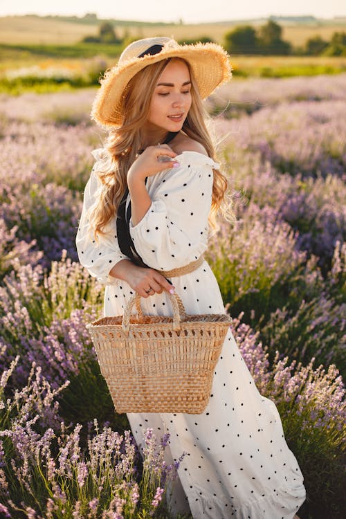 Free Woman Wearing Straw Hat in Lavender Field Stock Photo