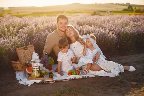Family Having Picnic on Lavender Field
