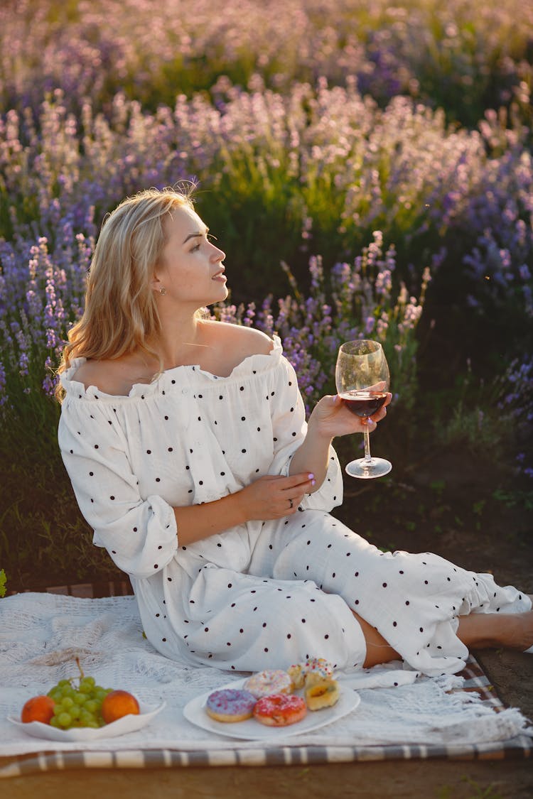 Beautiful Woman Drinking Wine On Lavender Field