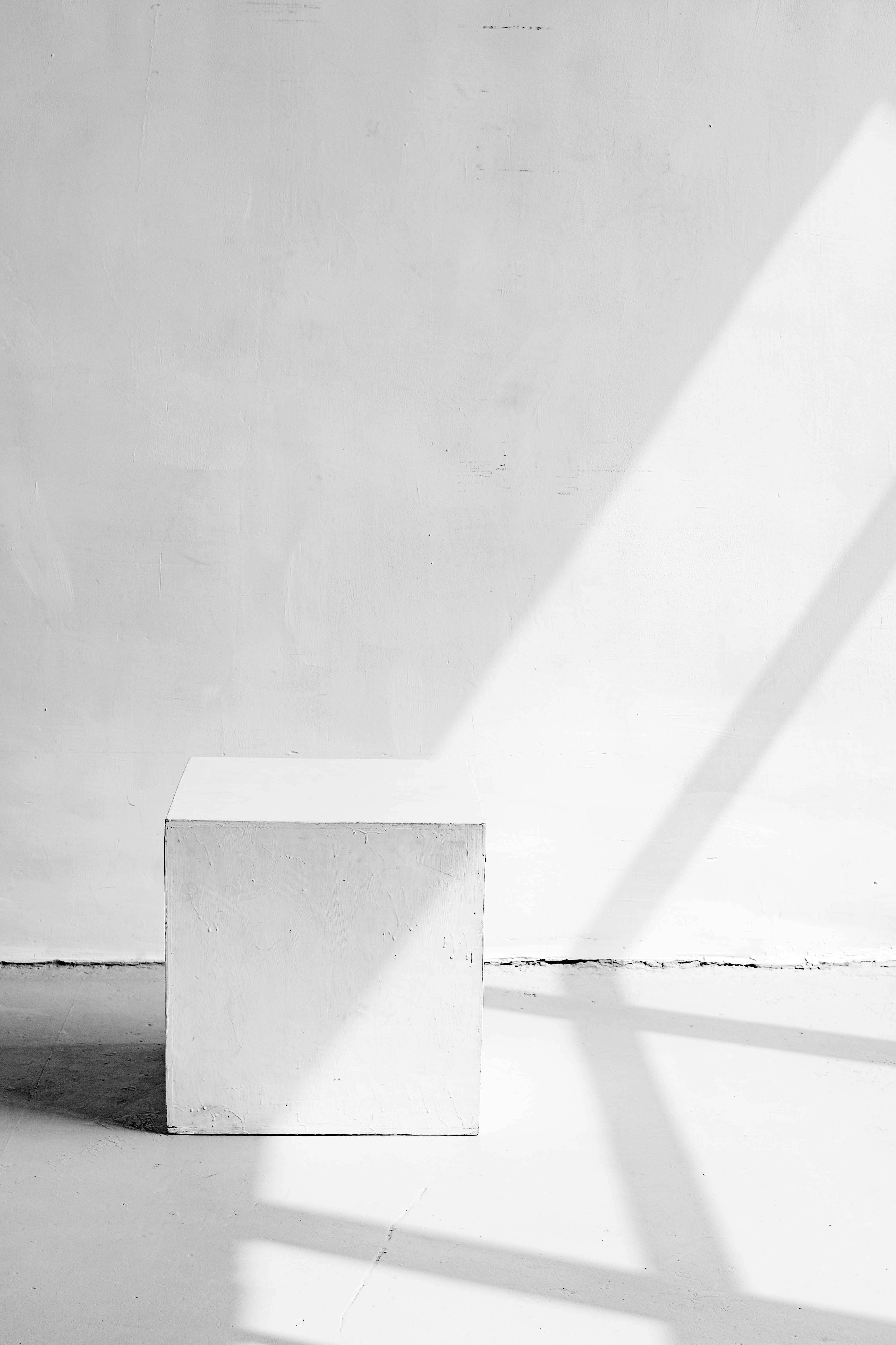 cube stool in white studio in sunlight