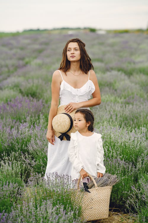 A Mother and Daughter in a Flower Field