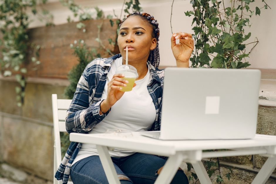 woman drinking green smoothie morning