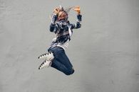 Woman Wearing Casual Clothes during Jump