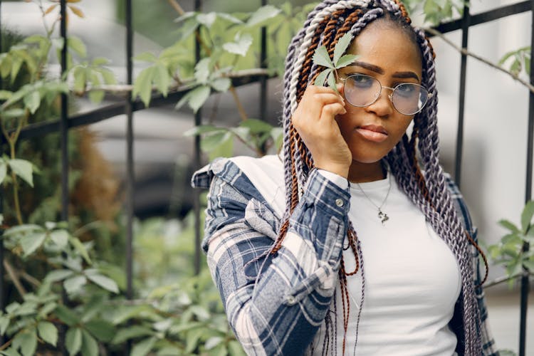 Portrait Of Woman With Colorful Braids