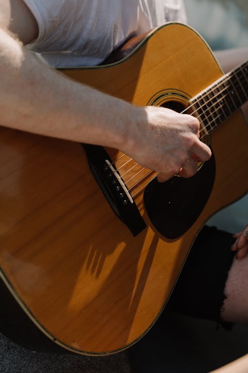 Close up of a Person Playing Guitar