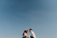 Couple Kissing Under Blue Sky