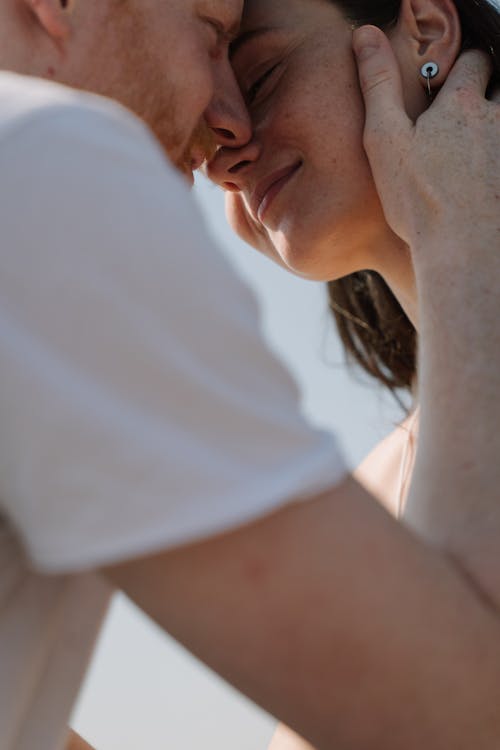 Free Woman in White Shirt Holding Her Chin Stock Photo