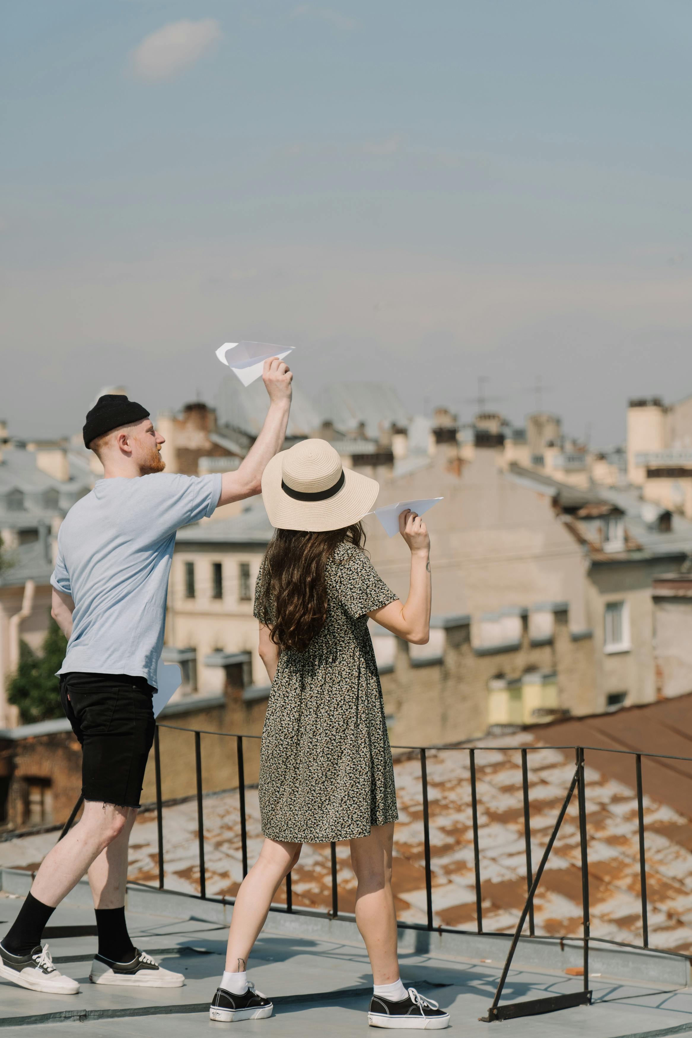 Man and Woman Standing on Balcony · Free Stock Photo
