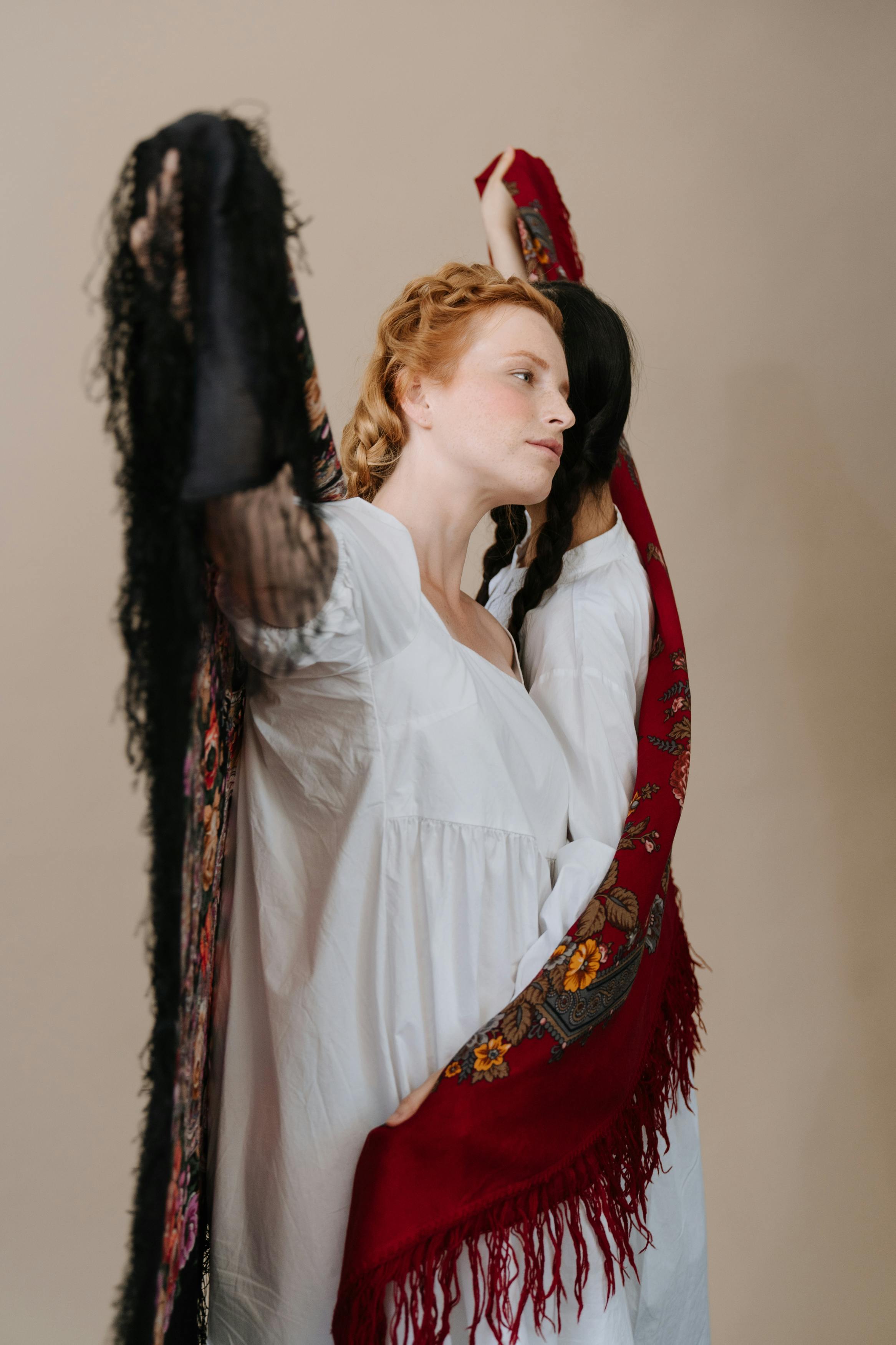 woman in white dress shirt and red scarf