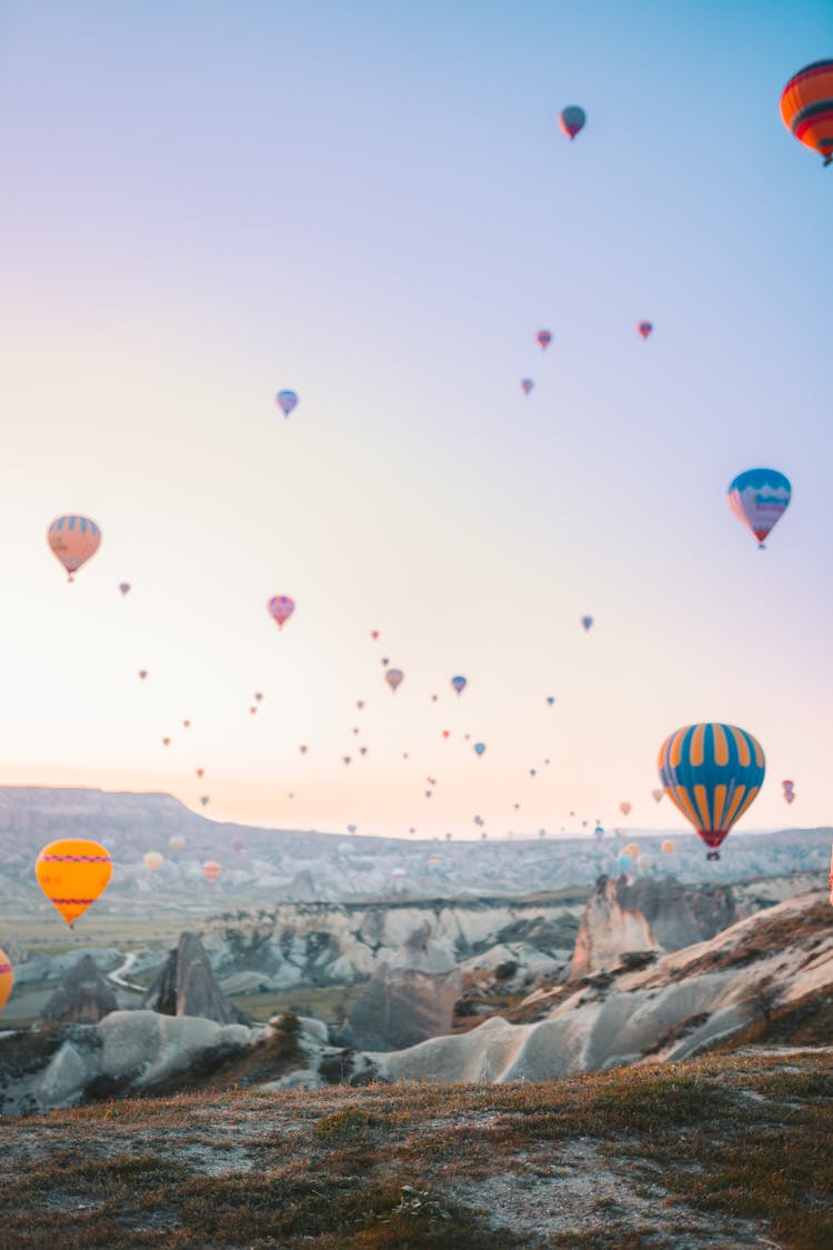 Colorful Hot Air Balloons Flying Over Cappadocia Rock Formations