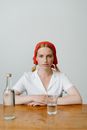 Woman in White Button Up Shirt Wearing Red Bandana