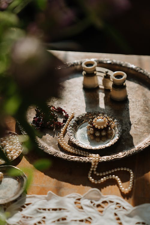 Free Silver and Gold Round Analog Watch on Brown Wooden Table Stock Photo