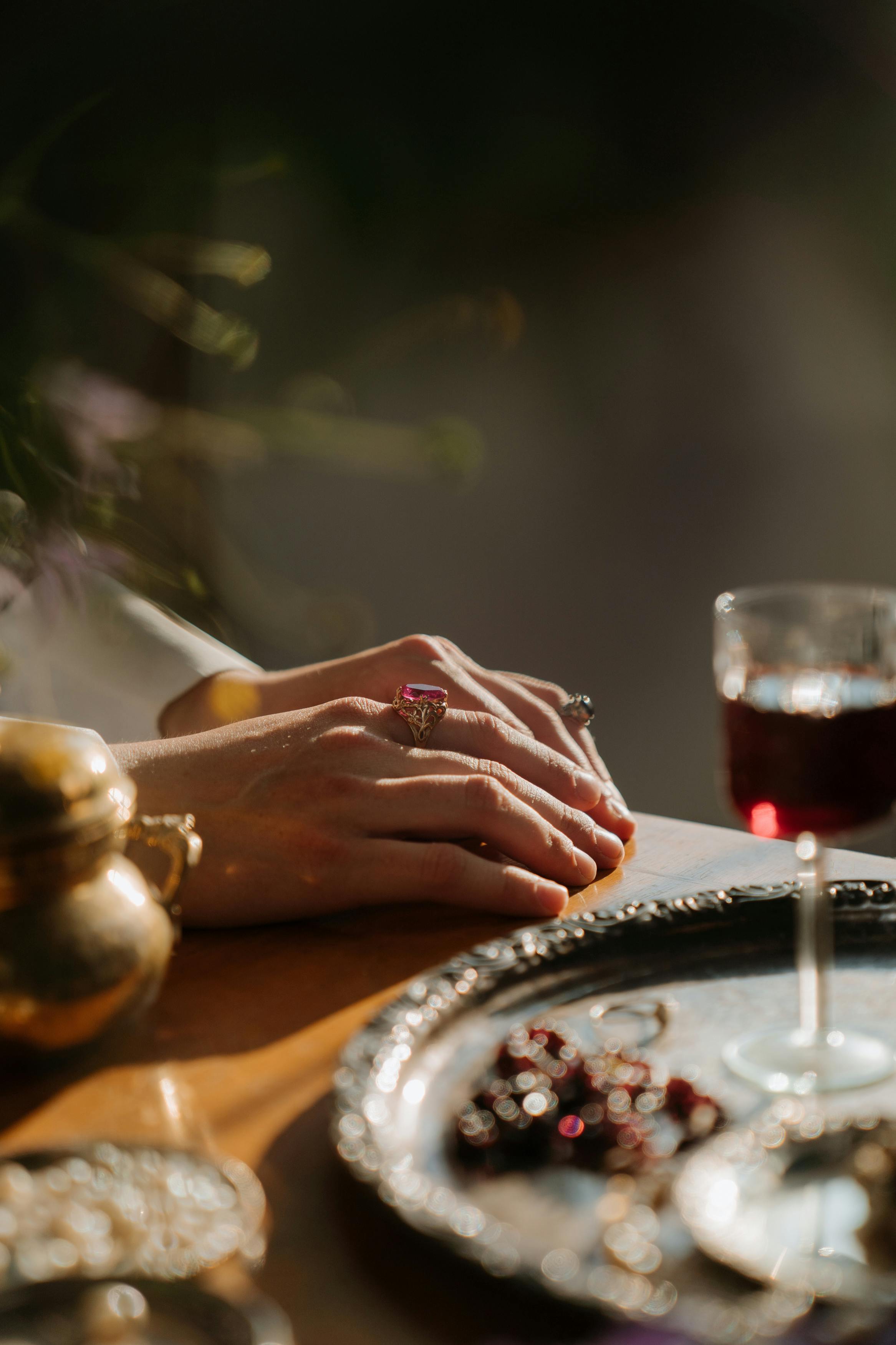 person holding clear wine glass