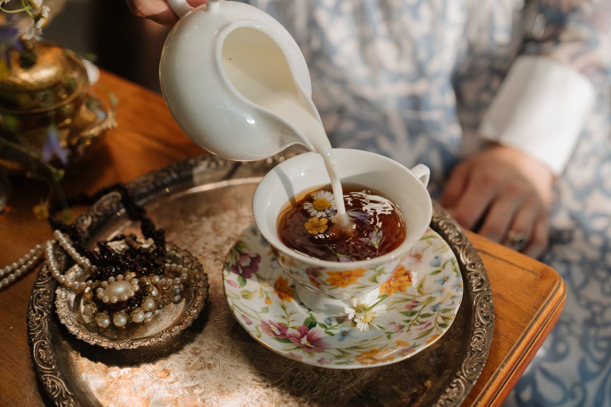White ceramic mug with brown milk tea liquid