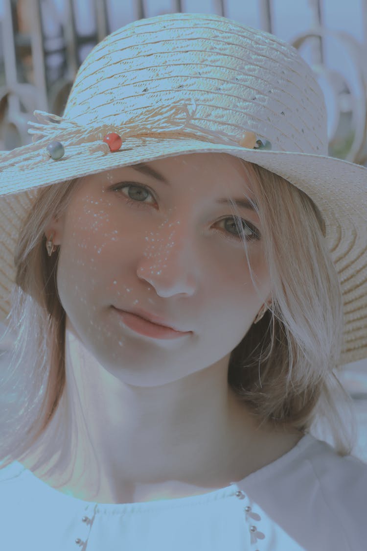 Close-Up Shot Of A Beautiful Woman Wearing Floppy Straw Hat