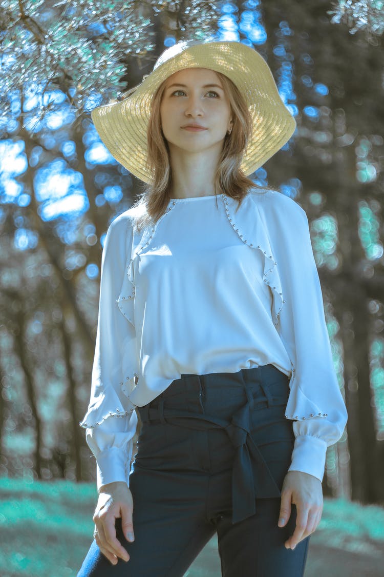 Selective Focus Of A Beautiful Woman Wearing Floppy Straw Hat