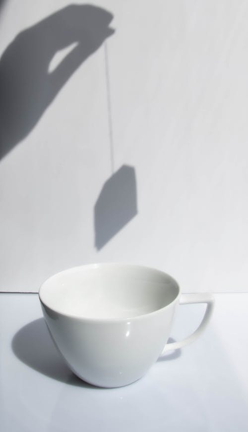 Free Empty white cup on white table Stock Photo