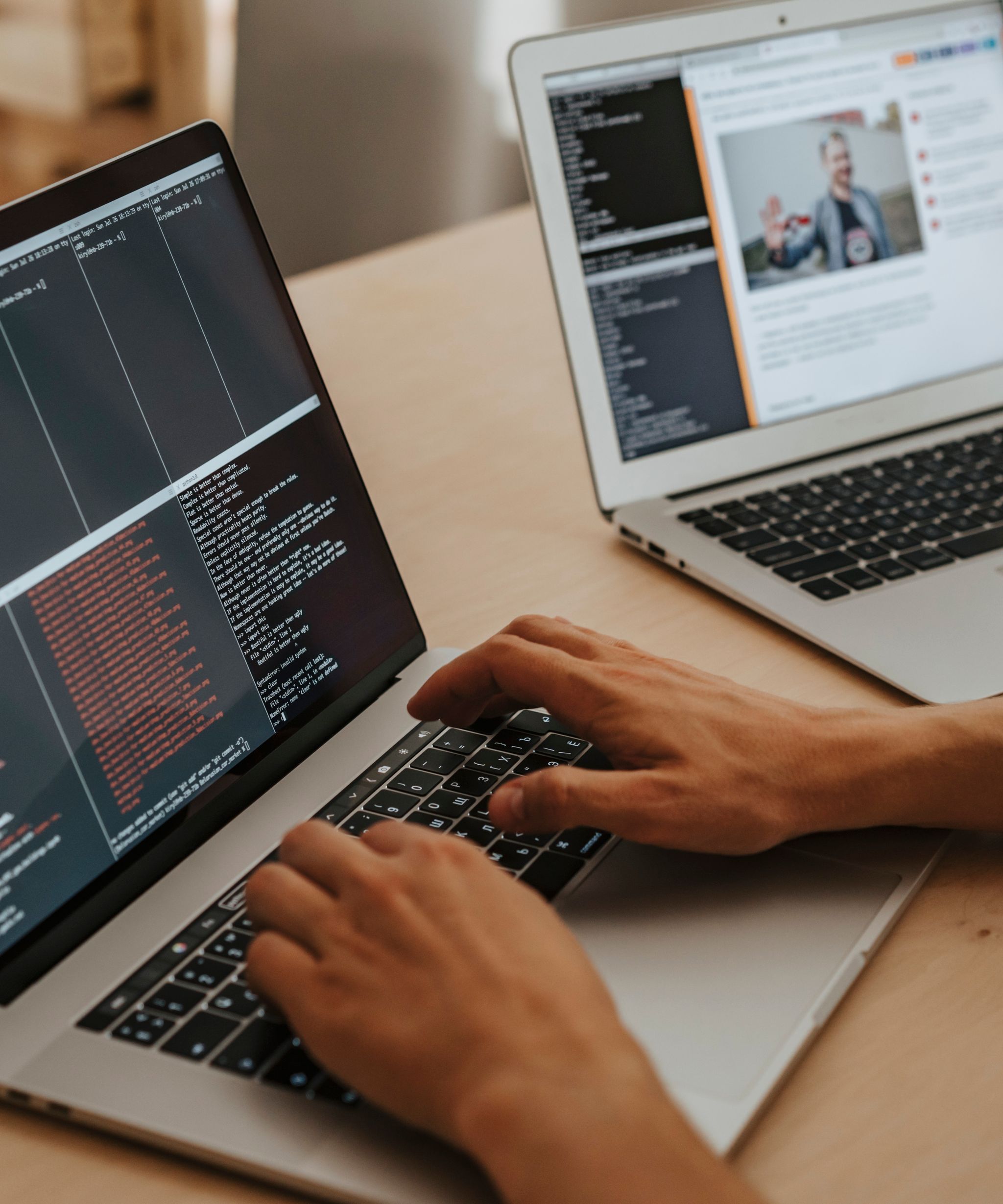 Developer working at a desk with two monitors