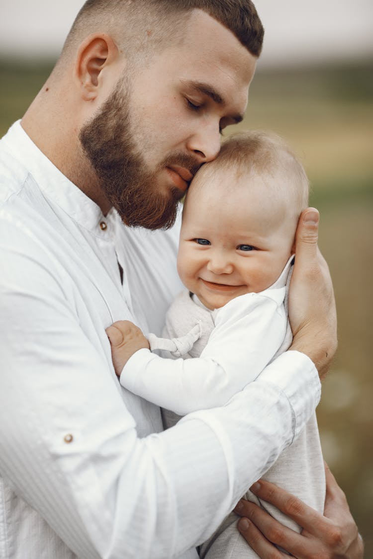 Young Father Holding Baby Infant