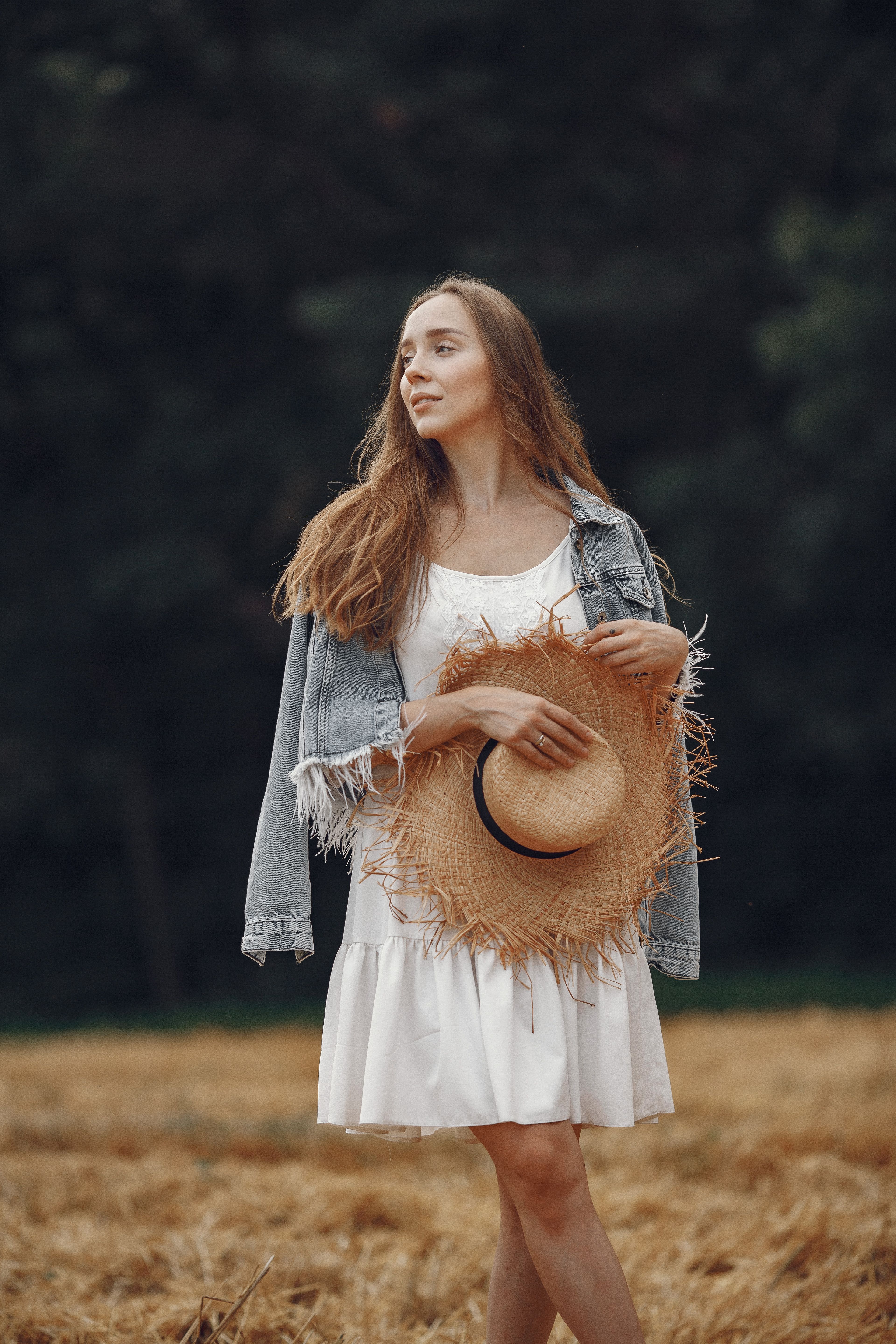 Woman in White Dress Holding her Straw Hat · Free Stock Photo