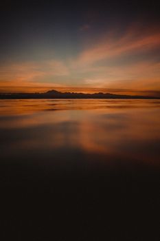 Serene sunset scene over the calm waters in Guinayangan, enhancing tranquility.