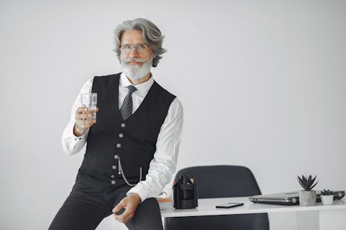 Man With Water Glass in Office