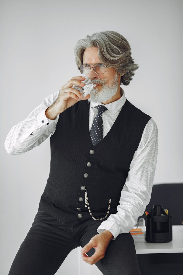 Man Drinking Water In Office