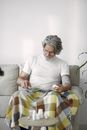 Man Using Pressure Gauge on Sofa