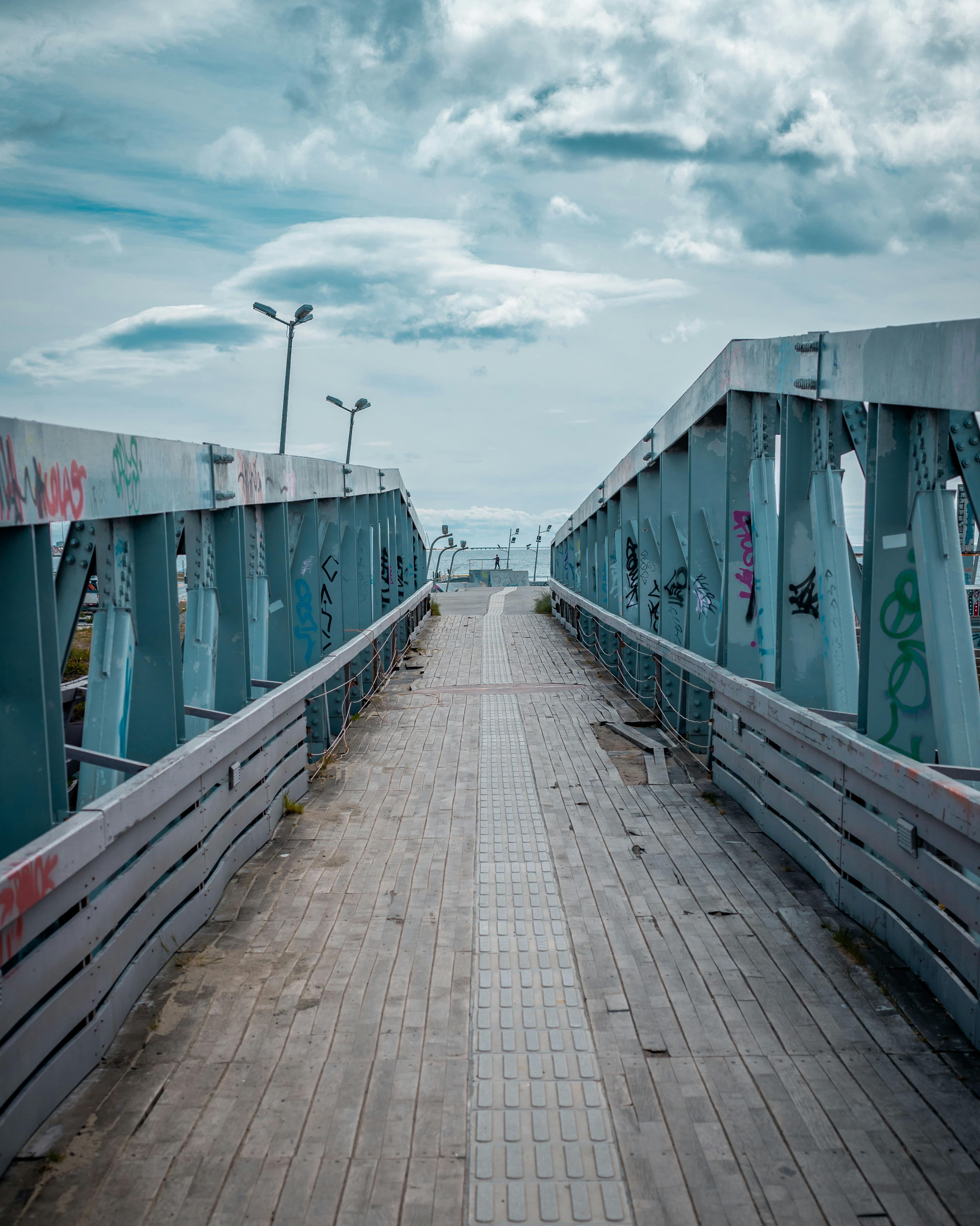 brown wooden dock under blue sky